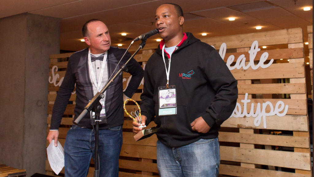 Featured image: Taz Technologies CEO Abdulaziz Mohamed speaking at the SA Innovation Summit in Cape Town after receiving first prize at the Main Pitching Den (SA Innovation Summit via Twitter )