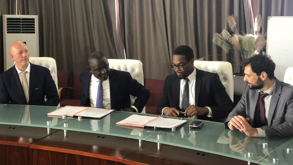 Featured image: Representative of the Senegalese government and GreenTec Capital at the signing of the partnership agreement (Supplied)