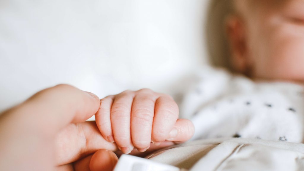 https://www.pexels.com/photo/person-holding-baby-s-hand-2721581/