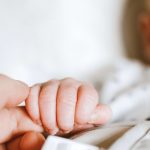 https://www.pexels.com/photo/person-holding-baby-s-hand-2721581/
