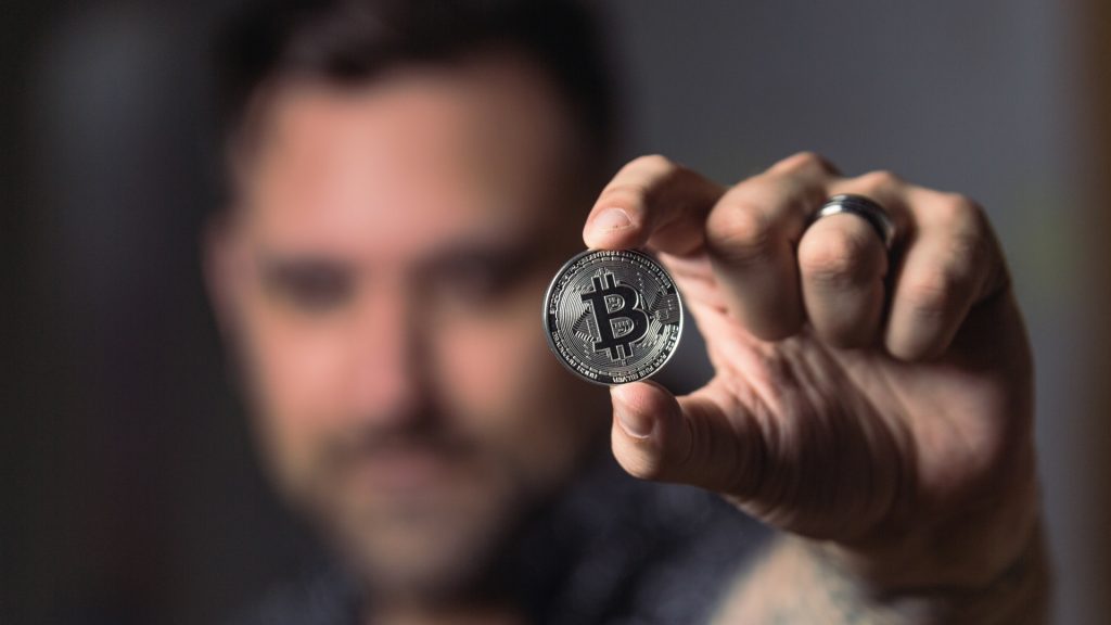 https://www.pexels.com/photo/person-holding-silver-bitcoin-coin-1447418/