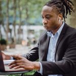 https://www.pexels.com/photo/focused-black-businessman-analyzing-data-on-laptop-in-street-cafe-4559598/