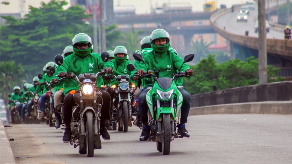 Image of multiple Kwik motorcycle drivers on their motorcycles on a road