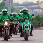 Image of multiple Kwik motorcycle drivers on their motorcycles on a road