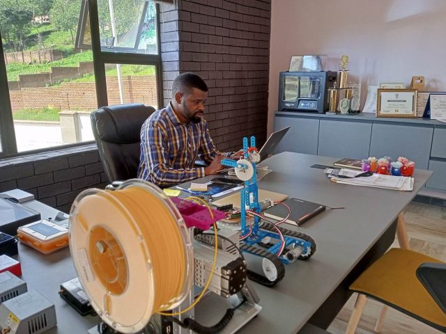 Mayamiko Nkoloma, an inventor and telecommunications lecturer at the Malawi polytechnic, works at his office in Blantrye, Malawi. January 13, 2022. Thomson Reuters Foundation/Charles Pensulo