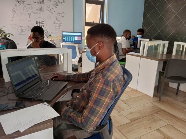 Young innovators work at computers at the University of Malawi in Blantrye, Malawi. January 13, 2022. Thomson Reuters Foundation/Charles Pensulo