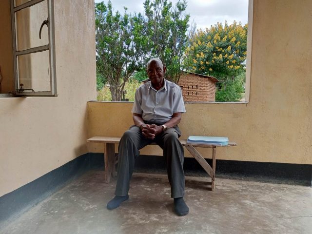 Healthtech: Stanley Ngwira sits on a bench inside his house in the Kasungu district in Malawi. April 20, 2022. Photo: Thomson Reuters Foundation/ Charles Pensulo