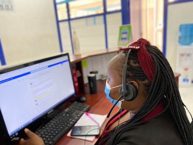Healthtech: A SASAdoctor employee receives a call from a patient at their offices in Nairobi, Kenya. January 2022. Photo: Thomson Reuters Foundation / Handout via SASAdoctor