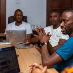 Local is king: Maxence Melo, founder of JamiiForums, talks to his colleagues during a meeting at their office in Dar es Salaam, Tanzania. Photo: Thomson Reuters Foundation/Yohana Haule