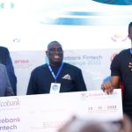 Ecobank Group chief executive Ade Ayeyemi hands over a cash prize of $50 000 to Touch and Pay chief executive Michael Oluwole. The Nigerian fintech emerged top in the bank’s annual challenge. Photo: Supplied/Ventureburn